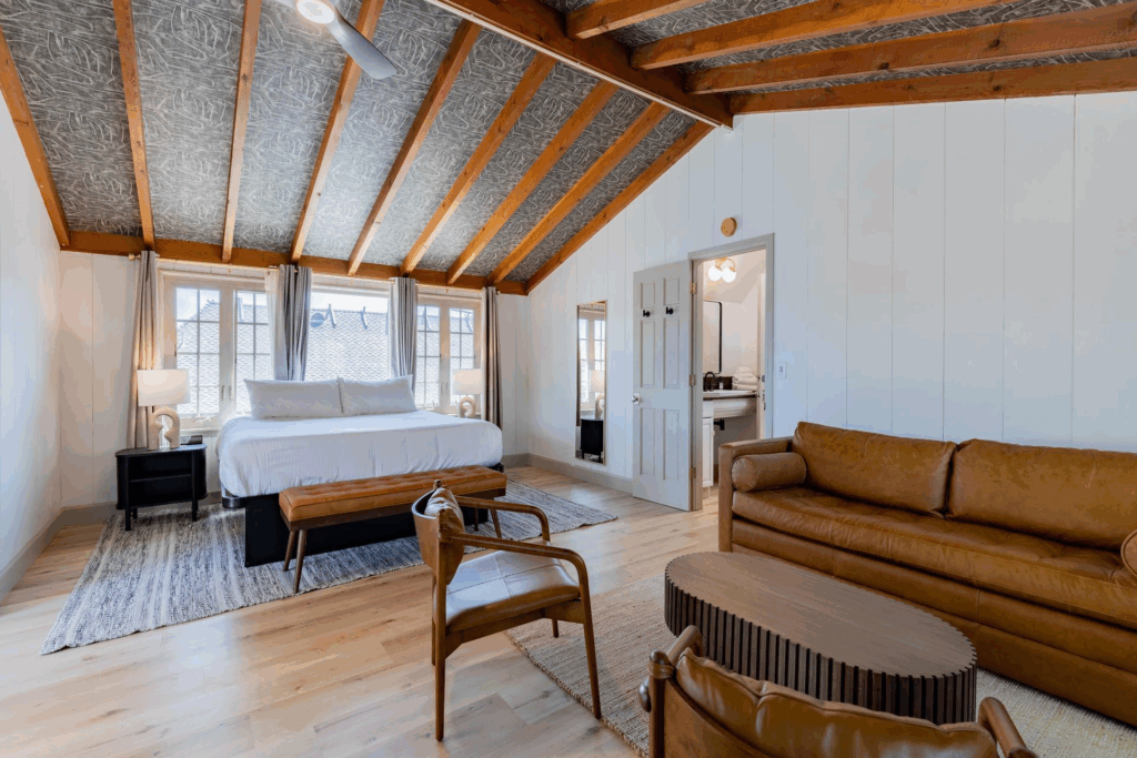 King Bed in a bright room with couch